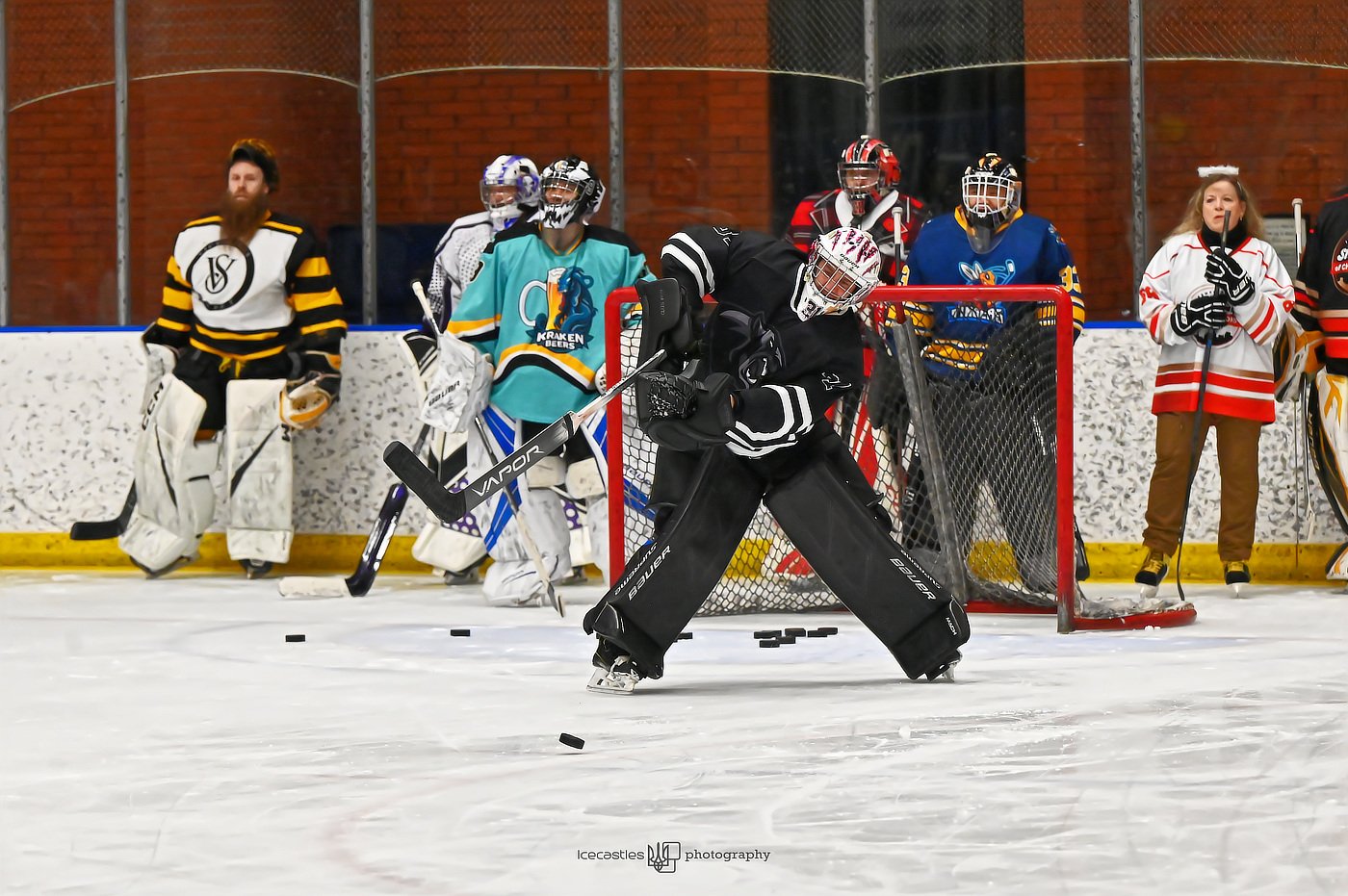 Home | Shinny of Champions Beginner goalie in full gear practicing shooting during SOC summer goalie clinic